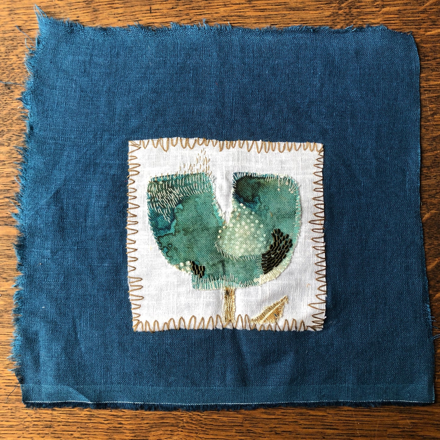Turquoise Tulip Embroidery with Charcoal Stitches