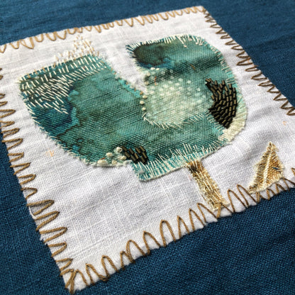 Turquoise Tulip Embroidery with Charcoal Stitches